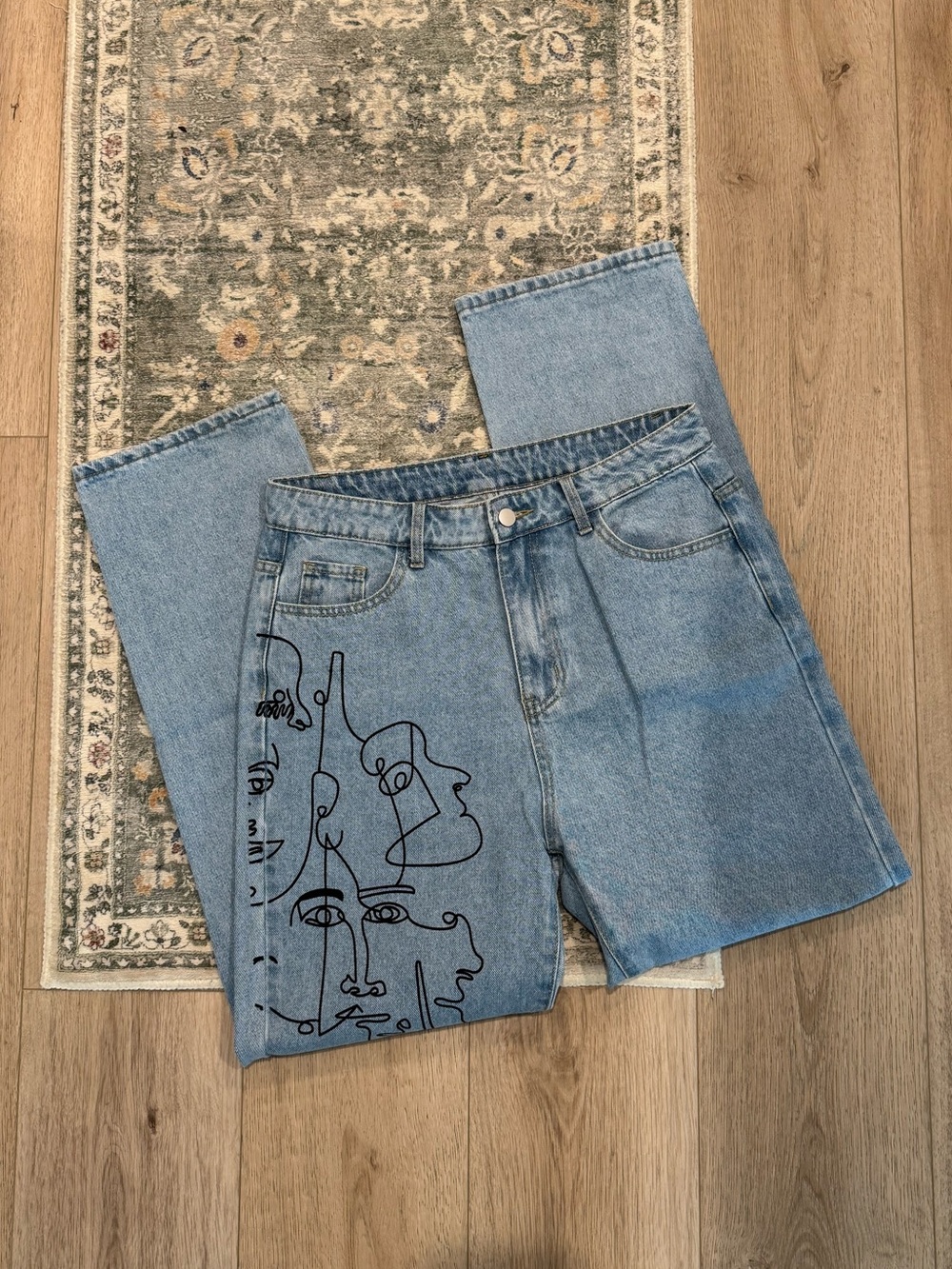 SHEIN Light Blue Denim Relaxed Jeans with Black Face Line Art